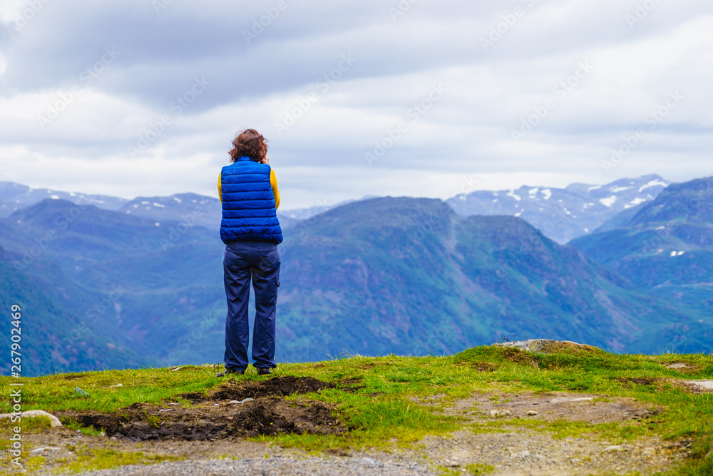 Naklejka premium Tourist enjoy mountains view, Norway