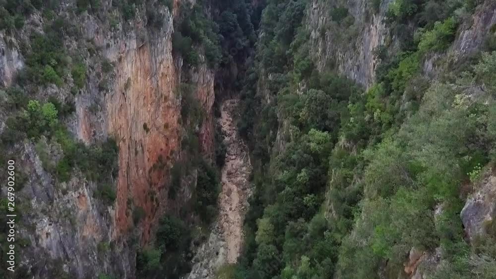 Flying in the middle of a canyon. Gjipe Canyon in Albania along the Albania Riviera near Gjipe Beach during sunset Flying in the middle of a canyon. Gjipe Canyon in Albania along the Albania Riviera near Gjipe Beach during sunset