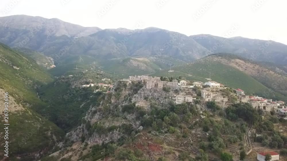 Beautiful Albania Castle along the Albania Riviera surrounded by mountains in the background a cute village in Europe Beautiful Albania Castle along the Albania Riviera surrounded by mountains in the background a cute village in Europe