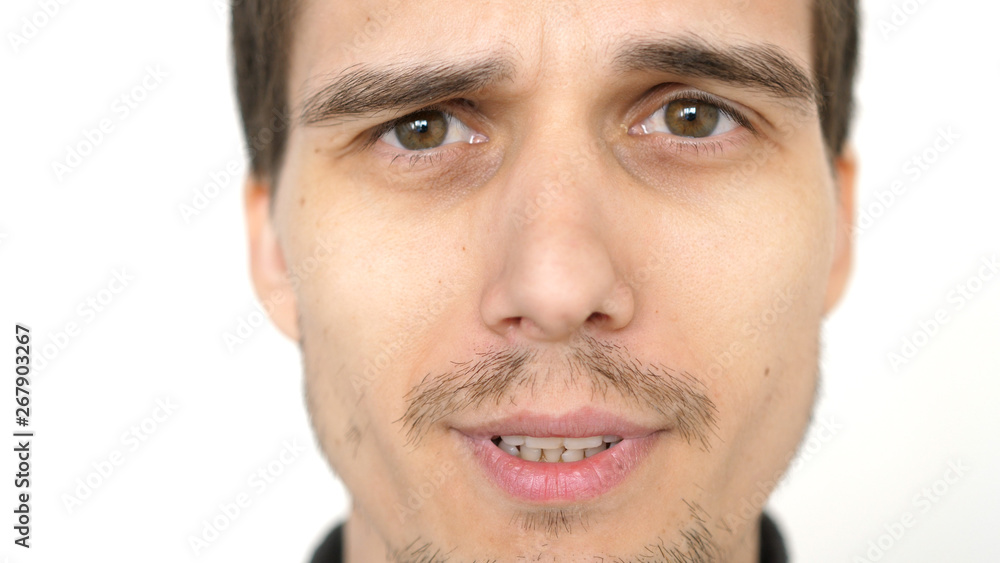 Face of young attractive talkative man on a white background Face of young attractive talkative man on a white background