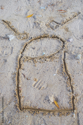 children's drawing on sand drum with sticks