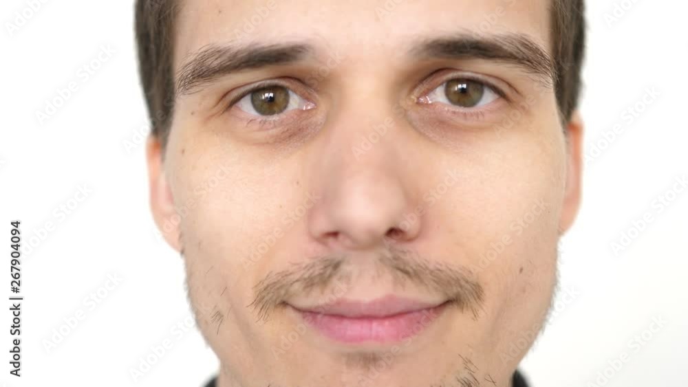 portrait of young attractive successful smiling man on a white background. slow motion. 3840x2160 portrait of young attractive successful smiling man on a white background. slow motion. 3840x2160