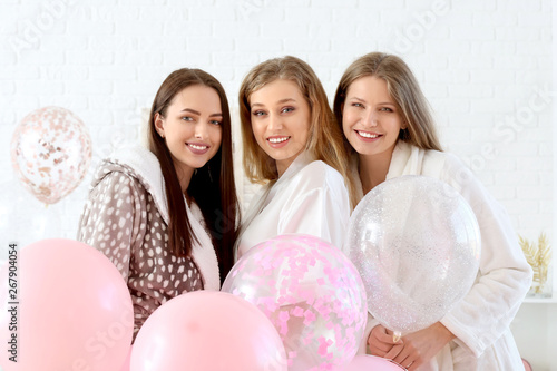 Three happy young women in ...