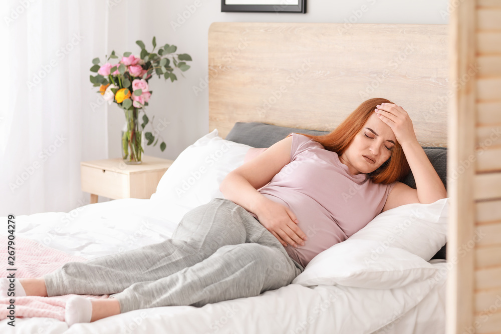 Young pregnant woman feeling bad at home Young pregnant woman feeling bad at home