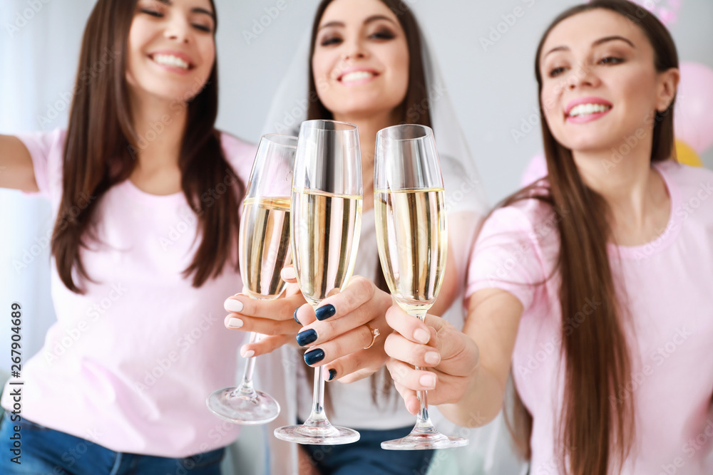 Beautiful young women drinking champagne at hen party Beautiful young women drinking champagne at hen party