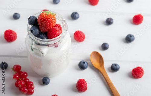 yogurt with fruit on a breakfast table on a white background