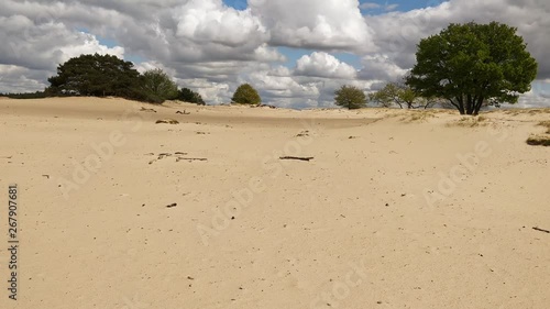 Erosion due to overgrazing with desertification as result photo