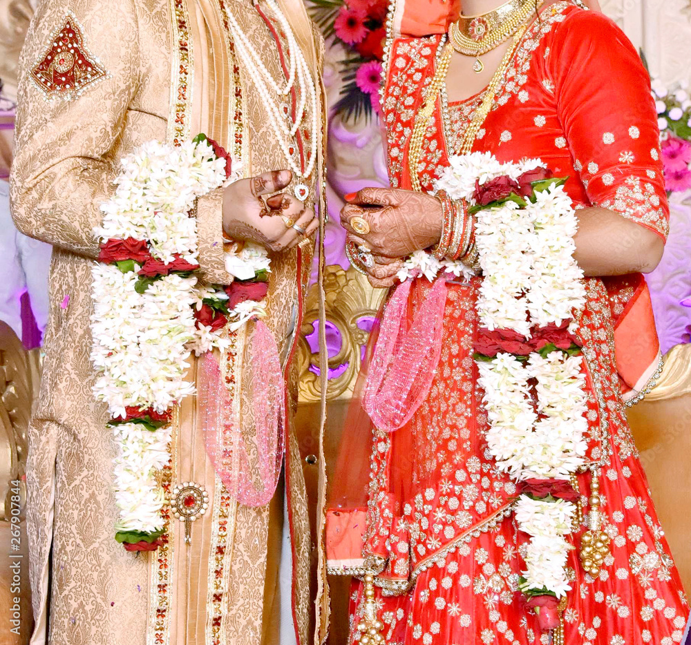 The bride and groom at the Indian wedding garlands or Jaimala ceremony Stock Photo Adobe Stock