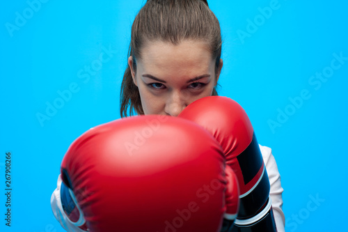 Strong and confident businesswoman wearing blouse and boxing gloves © pavel_shishkin