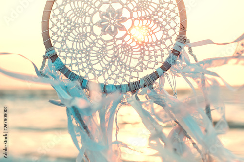 Canvastavla Dream catcher against sunrise. Handmade work is ethnic symbol