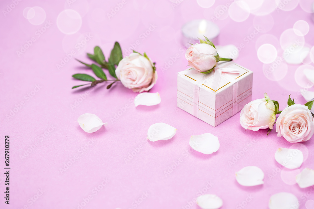 Plakat Rosebuds, petals,, gift box on a pink background. Concept for a greeting card. Weddings, Valentine's Day, Birthday