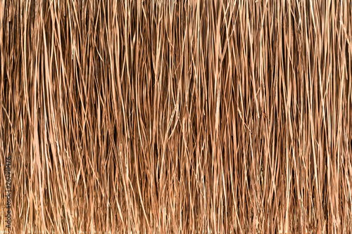 Obraz na plátně Thatched roof or wall background. Tropical roofing on beach