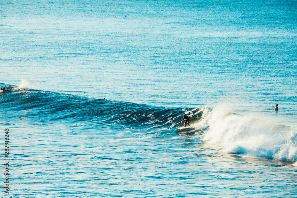 Surfers and Waves at Bells Beach, Australia Surfers and Waves at Bells Beach, Australia