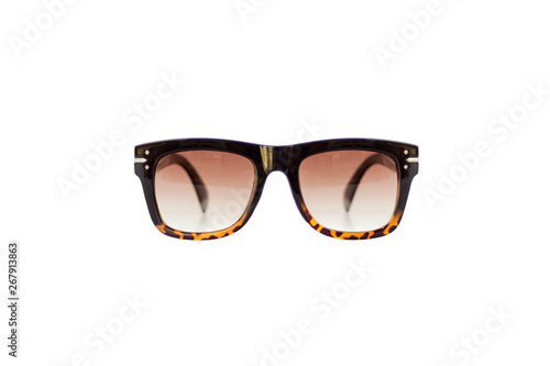 Isolated image of brown gradient sunglasses, front view. Leopard patterned texture at bottom of the frame. Earpiece part is black colored and thick. Retro, flat top and wayfarer style.