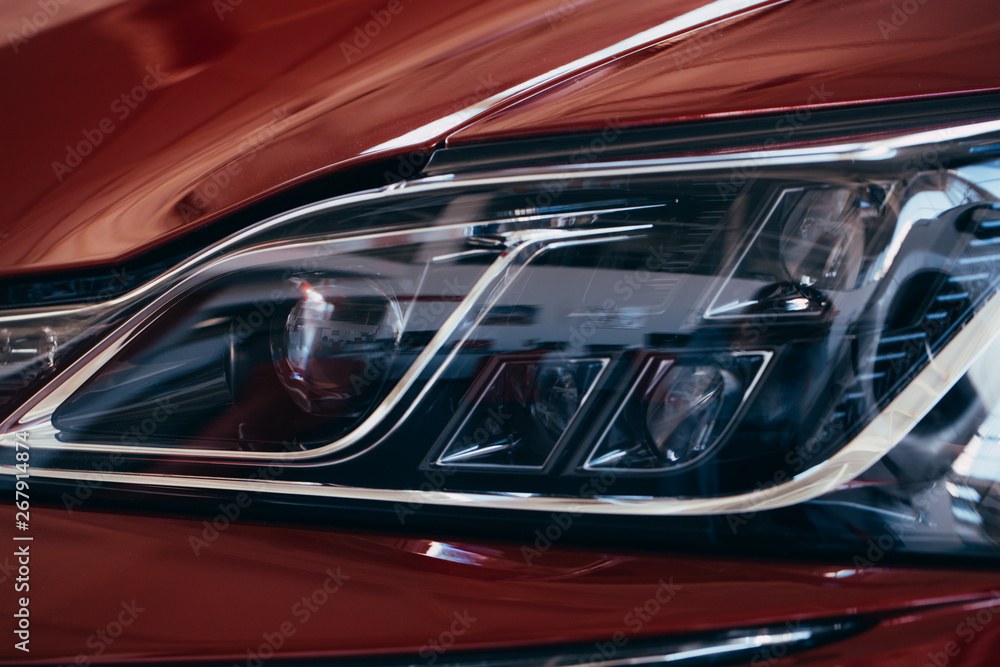 Close up detail on one of the LED headlights modern car.