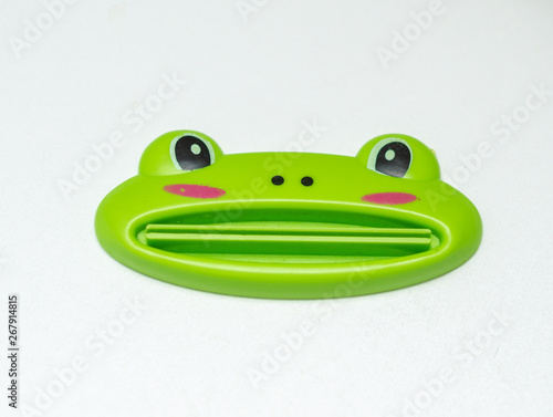 Obraz na płótnie frog toothpaste squeezer on white background