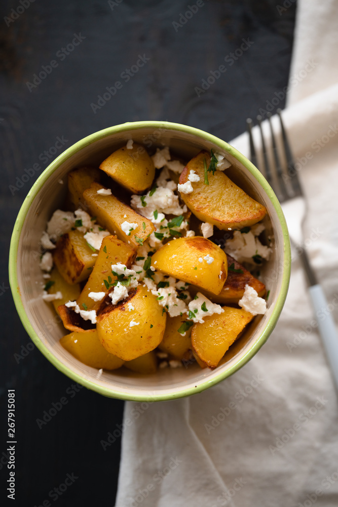 Plate of hot Patatas Bravas, a traditional Spanish tapas dish, fried or