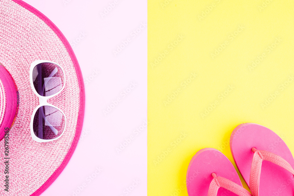 Beach accessories sunglasses, flip flop starfish beach hat and sea shell on pink and yellow background for summer holiday and vacation concept. Beach accessories sunglasses, flip flop starfish beach hat and sea shell on pink and yellow background for summer holiday and vacation concept.