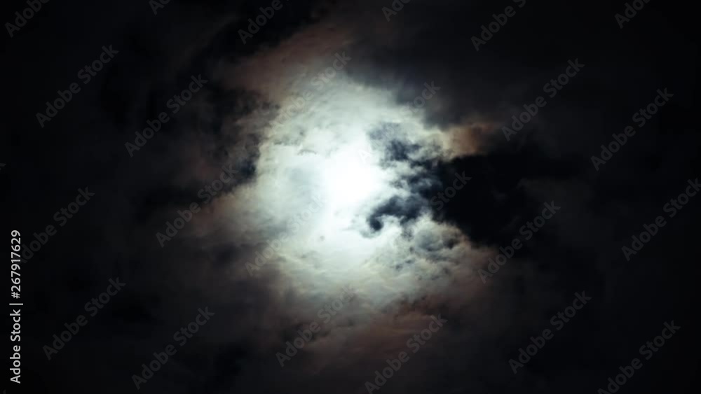Dreams midnight moon on dark night blue sky on cloudy day. Bright white moon between volume cumulus clouds. Dreams midnight moon on dark night blue sky on cloudy day. Bright white moon between volume cumulus clouds.