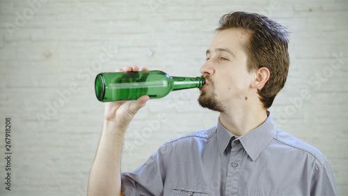 Man drink beer from bottle