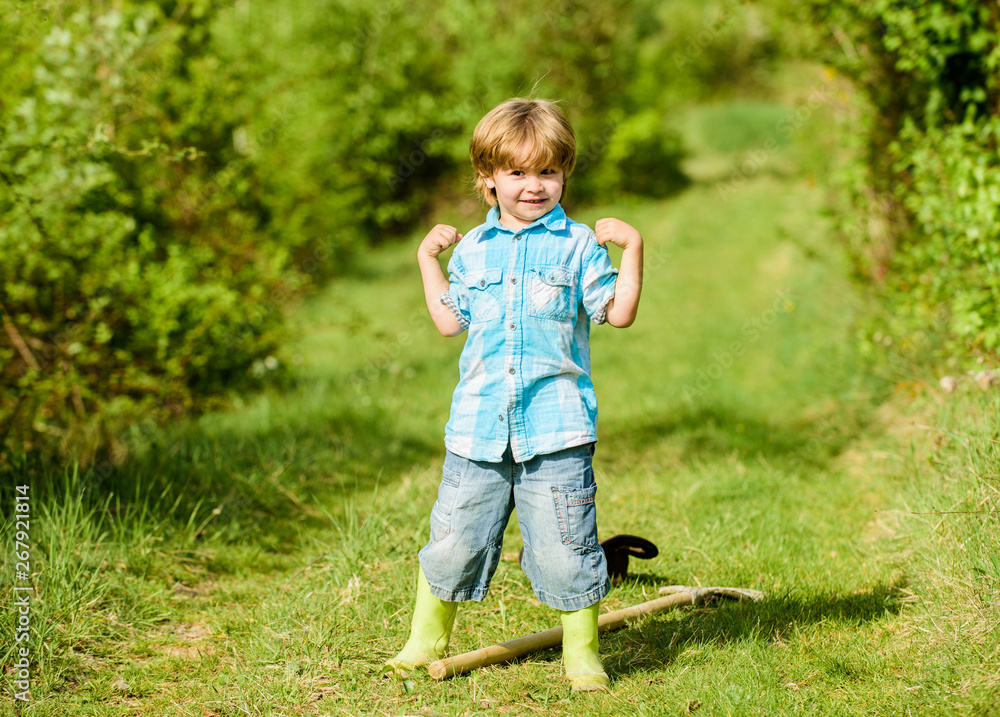 small kid gardener having fun. human and nature. farming and agriculture cultivation. happy child farmer play with garden shovel, spring. earth day. Eco life. summer activity. Capturing happy moment small kid gardener having fun. human and nature. farming and agriculture cultivation. happy child farmer play with garden shovel, spring. earth day. Eco life. summer activity. Capturing happy moment