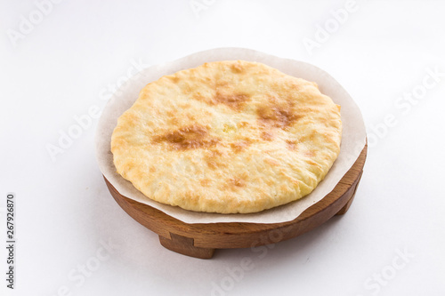 Crispy homemade puff cheese pie isolated on white background