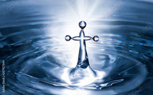 Fotografia Christian holy water with crucifix cross background