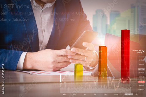 Multi exposure of  investor with tablet and tradeview graph. photo