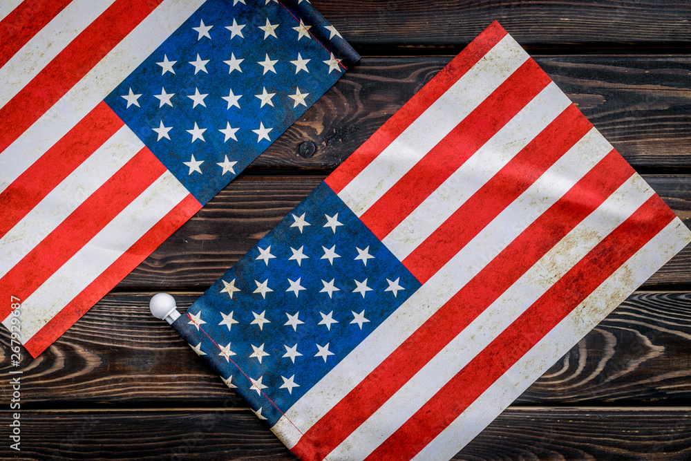 Obraz premium USA national day background with flag on wooden desk top view