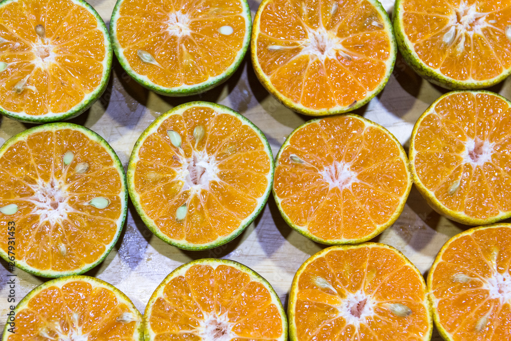 Fresh orange fruits, Background of halves of orange Fresh orange fruits, Background of halves of orange