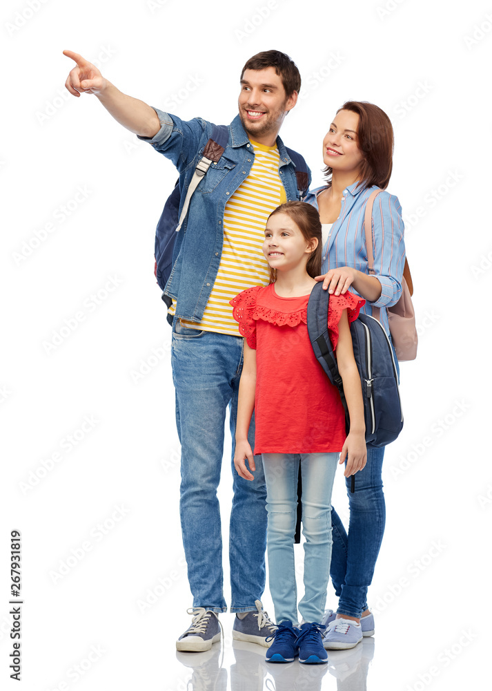 Fototapeta premium family, tourism and travel concept - happy smiling mother, father and little daughter with backpacks over white background