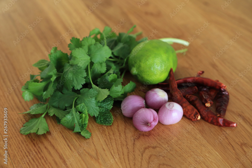 Fresh herbs - mint or peppermint, parsley, dry chilli, red shallot, green lime for cooking Thai food recipe. Fresh herbs - mint or peppermint, parsley, dry chilli, red shallot, green lime for cooking Thai food recipe.