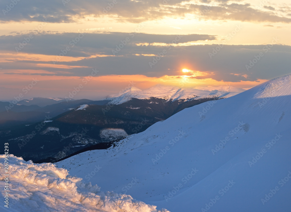 Sunset in winter mountain