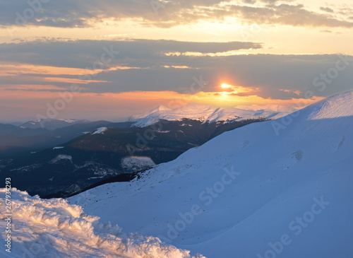 Sunset in winter mountain