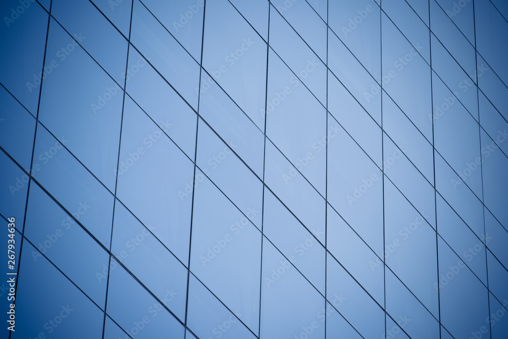 Modern office building with blue glass windows Modern office building with blue glass windows