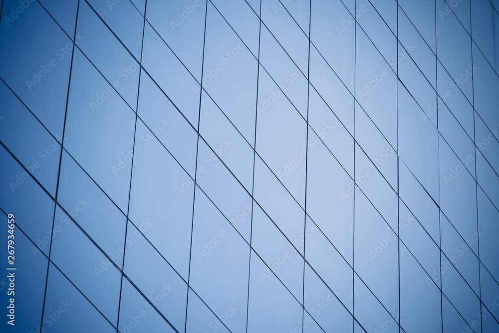 Modern office building with blue glass windows Modern office building with blue glass windows