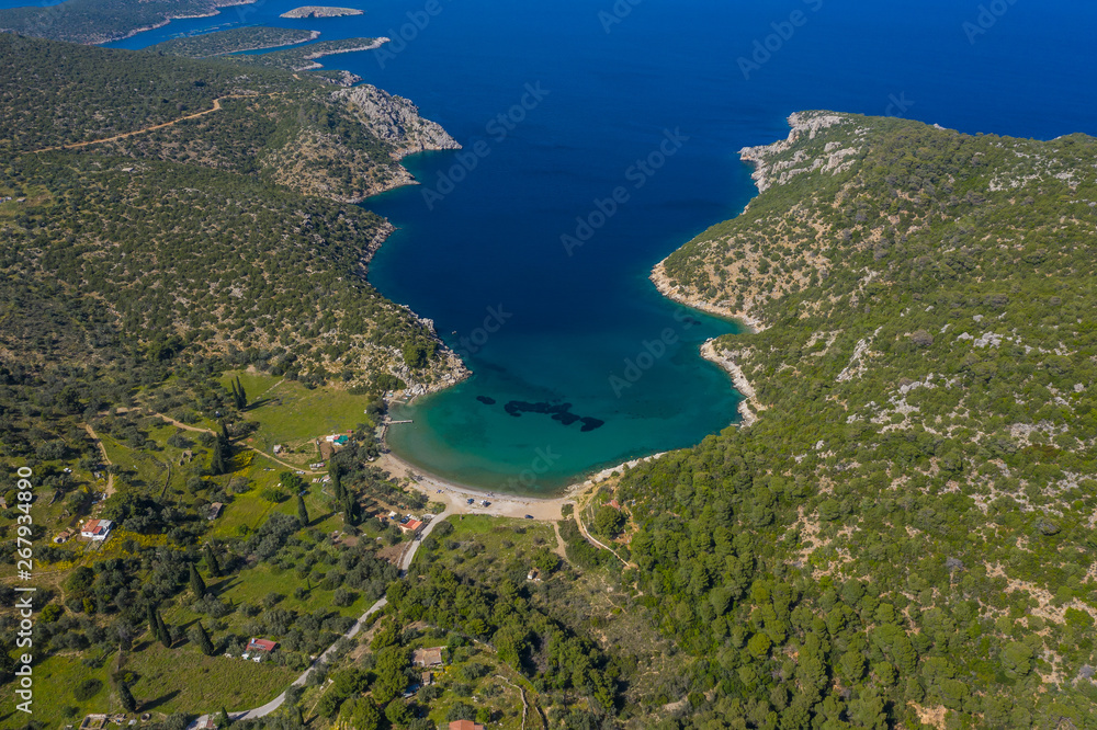 Top view Greek island Poros beache. Vagionia bay. Paralia Vagonia. Blue water and hills. Epic panaramic view. Travel destination. greece islands beaches. Aerial view from the drone