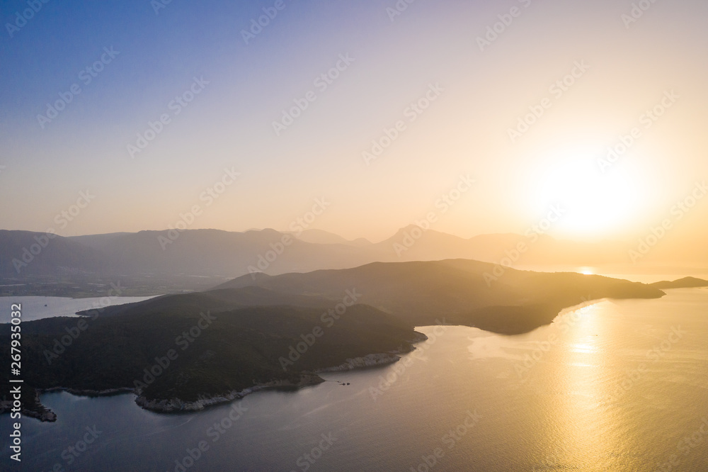 relaxing view of the golden islands at sunset. Poros Greece