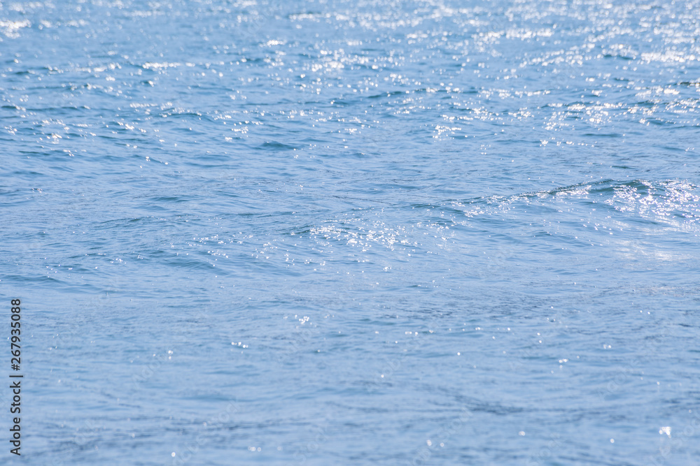 Obraz premium Blue waves on ocean surface