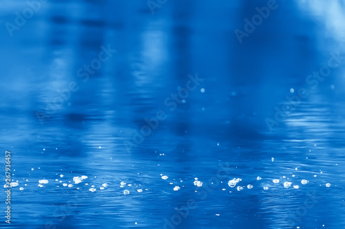 bubbles on the surface of the water stream / clear natural water, fast current, small river abstract background