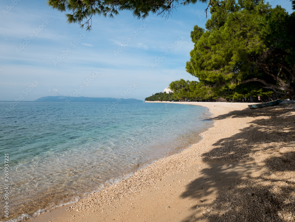 Obraz premium Empty beach and calm blue sea in Tucepi
