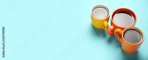 Black tea (coffee) in bright cups, office break, team building. photo