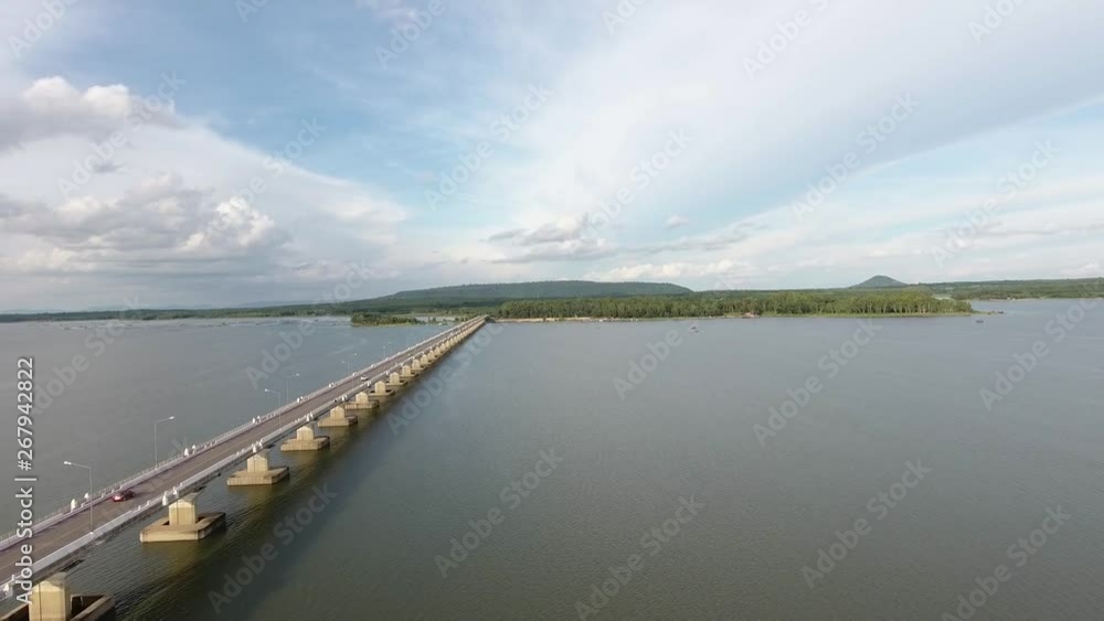 Aerial view above traffic crossing over the Thep suda Bridge on the Lam Pao Reservoir, Kalasin, Isaan Aerial view above traffic crossing over the Thep suda Bridge on the Lam Pao Reservoir, Kalasin, Isaan