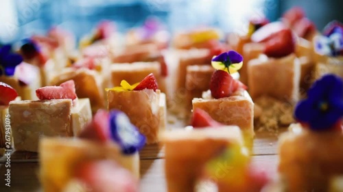 Closeup Catering Strawberry Cheesecake Bites Finger Food | Food Flower Decoration Dried Pansy Petals | Edible Flowers
