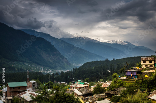 Aerial view of Mountain Village and in background Beautiful panoramic view of Mountain range in Manali, Himachal Pradesh. India.