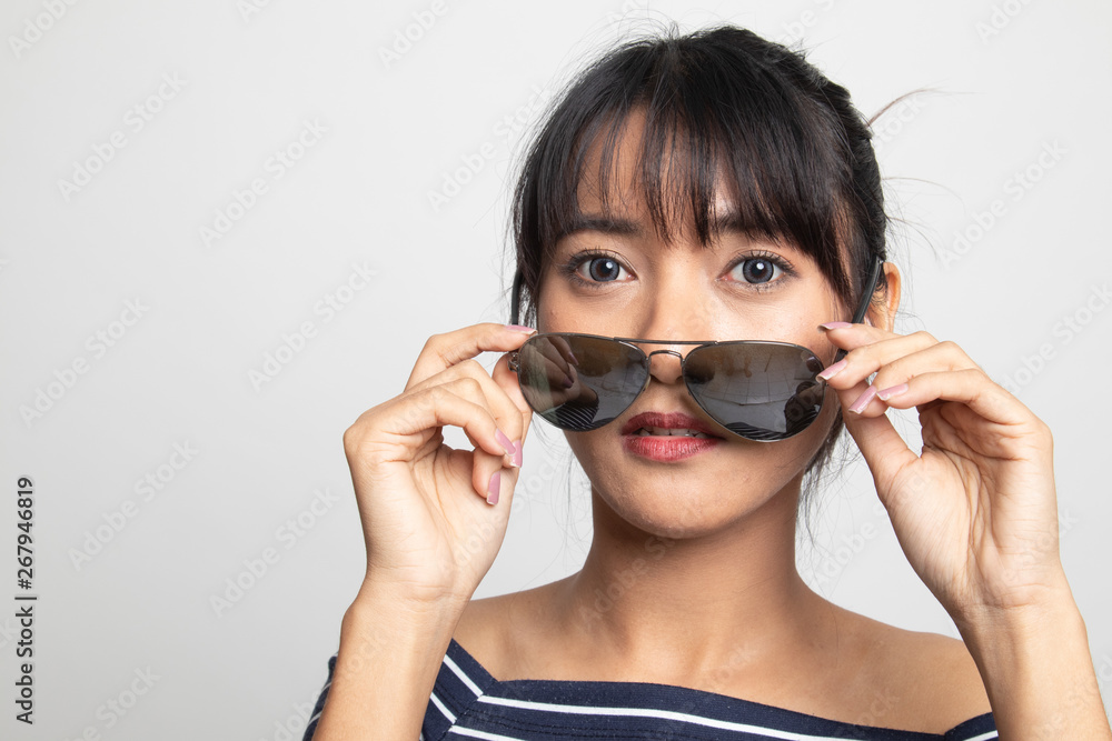 Portrait of beautiful young Asian woman with sunglasses Portrait of beautiful young Asian woman with sunglasses