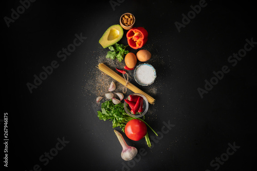 raw ingredients for cooking spaghetti marinara with poached eggs flat lay and copy spaces