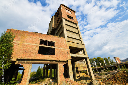 Carabash. Old ruined building, red brick factory, bottom view of blue sky. Horizontal photography. photo