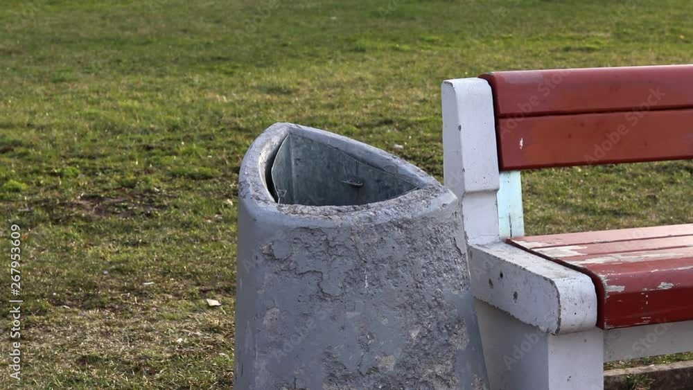Girl throws garbage in the ballot box in the city Girl throws garbage in the ballot box in the city