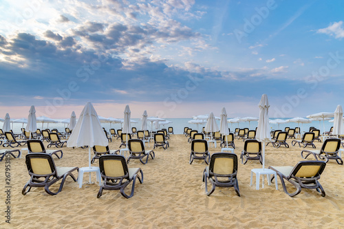 Chairs and umbrellas on a beautiful beach at sunrise in Sunny Beach on the Black Sea coast of Bulgaria